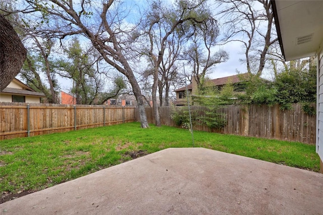 view of yard featuring a patio area and a fenced backyard