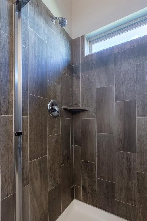 full bathroom with tiled shower