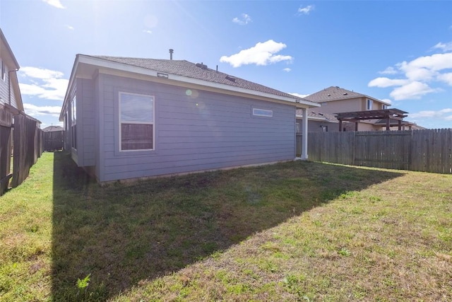 exterior space featuring a yard and a fenced backyard