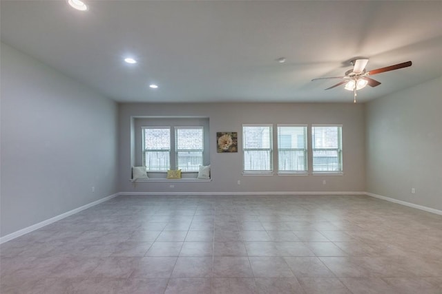 empty room with light tile patterned floors, baseboards, a ceiling fan, and recessed lighting