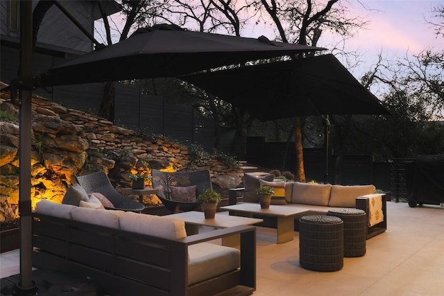 view of patio / terrace featuring outdoor lounge area and fence