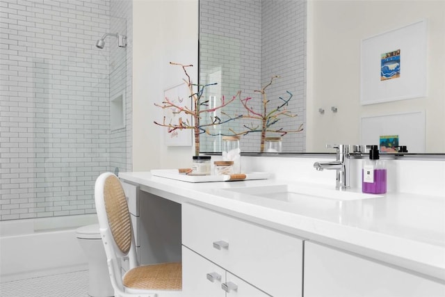 bathroom featuring tile patterned floors, toilet,  shower combination, and vanity