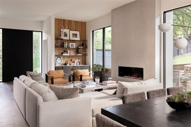 living room featuring a lit fireplace