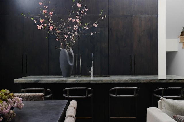 interior space with a sink and indoor wet bar