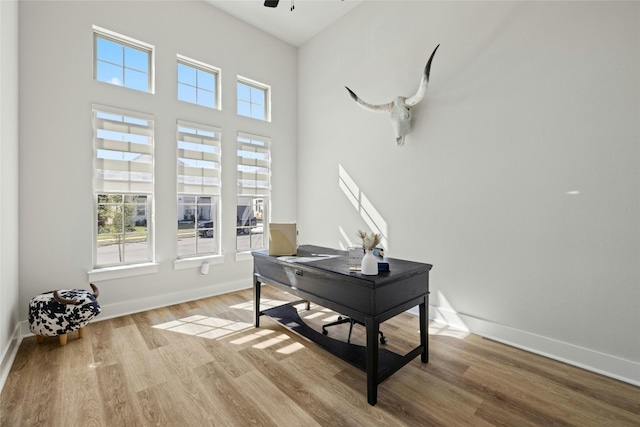 office space featuring wood finished floors and baseboards