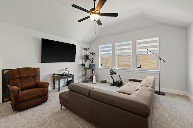 living area featuring baseboards, carpet, ceiling fan, and vaulted ceiling