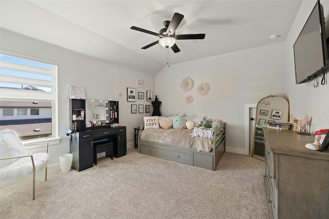 bedroom with baseboards, lofted ceiling, light carpet, and a ceiling fan