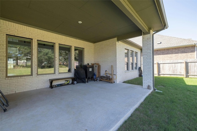 view of patio / terrace featuring fence