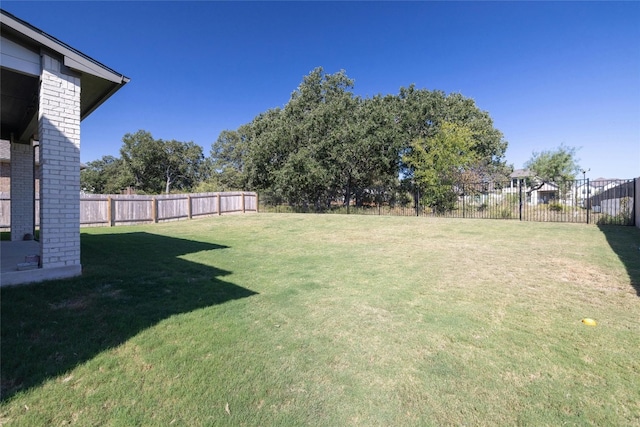 view of yard with a fenced backyard