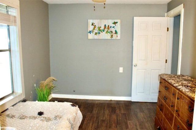 1221 Giddings St, Lexington, TX 78947 - dining space featuring dark wood-type flooring and baseboards