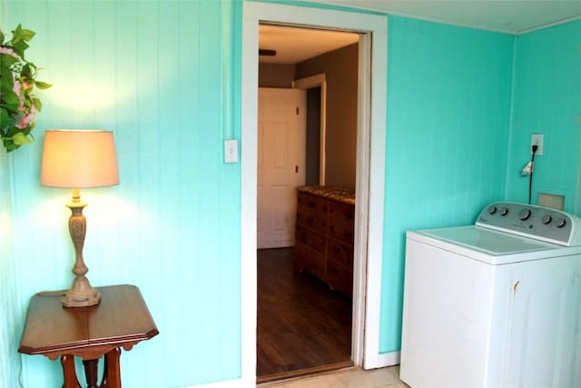 laundry room with light tile patterned floors, washer / dryer, and laundry area