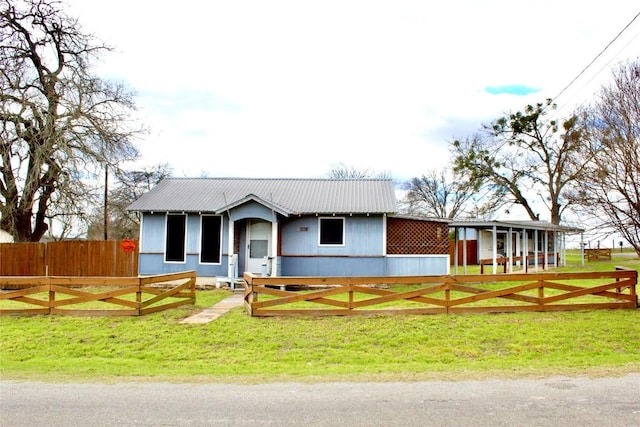 single story home with metal roof