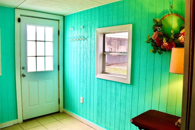 1221 Giddings St, Lexington, TX 78947 - doorway to outside with light tile patterned floors and baseboards
