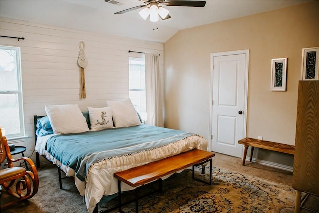 bedroom with visible vents, ceiling fan, carpet, and vaulted ceiling