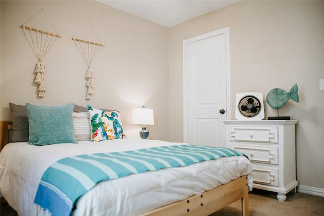 carpeted bedroom with baseboards