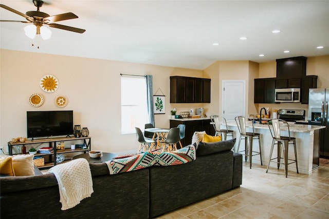 living room with light tile patterned floors, recessed lighting, and ceiling fan