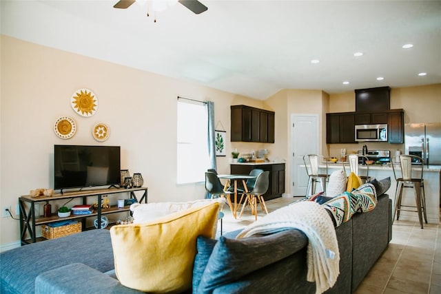 living area featuring recessed lighting, baseboards, light tile patterned flooring, and ceiling fan