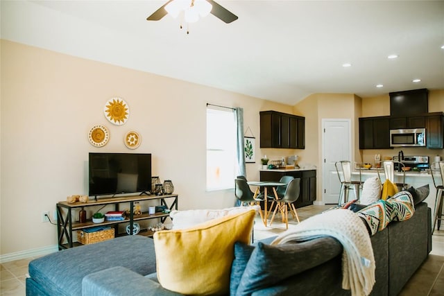 living area featuring light tile patterned floors, recessed lighting, baseboards, and ceiling fan