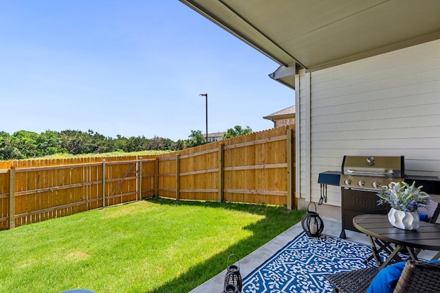 view of yard with a fenced backyard