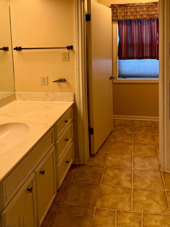 bathroom featuring vanity and tile patterned floors