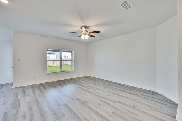 213 Seattle Slew Dr, Jarrell, TX 76537 - spare room with light wood-type flooring, a ceiling fan, and baseboards