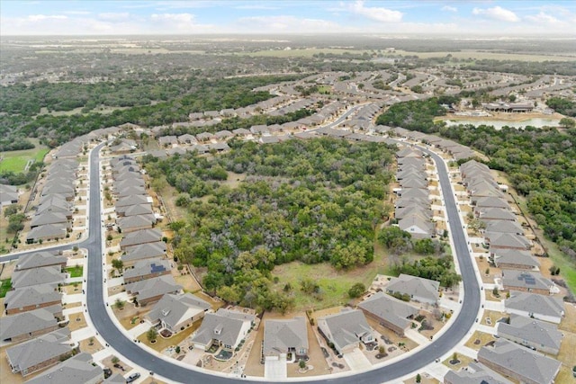 birds eye view of property with a residential view