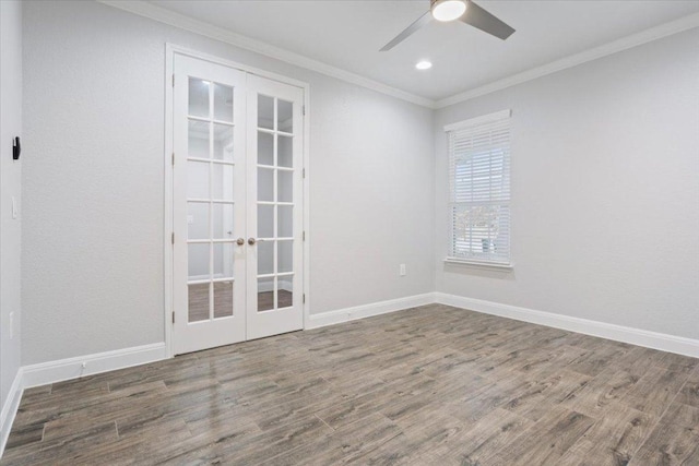 spare room featuring french doors, wood finished floors, and ornamental molding