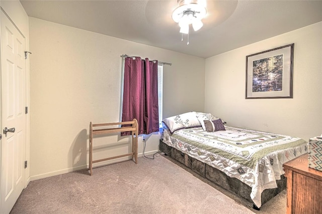 carpeted bedroom with baseboards and ceiling fan