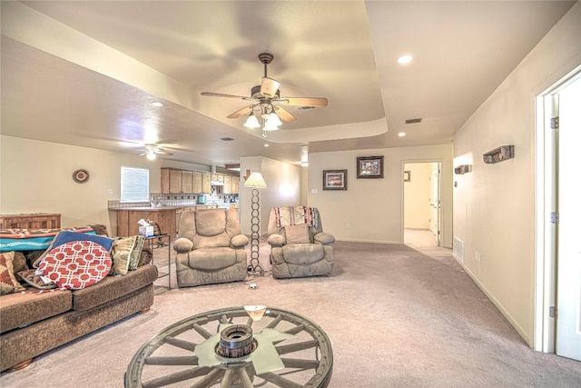 living room with light carpet, recessed lighting, baseboards, and ceiling fan