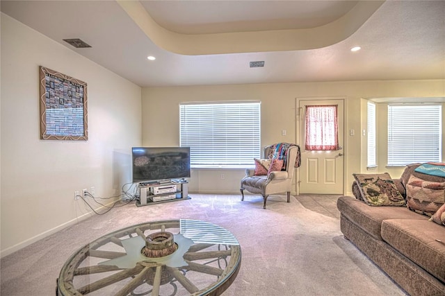 living room featuring visible vents, baseboards, carpet, recessed lighting, and a raised ceiling