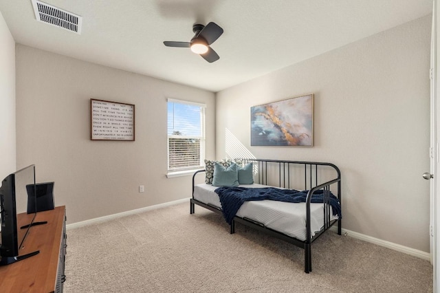 bedroom with visible vents, carpet floors, baseboards, and a ceiling fan