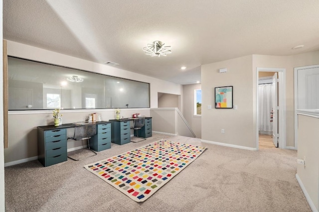 carpeted office space featuring recessed lighting, visible vents, baseboards, and a textured ceiling