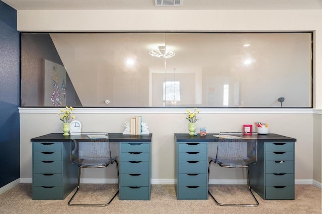 office area featuring visible vents, light carpet, and baseboards