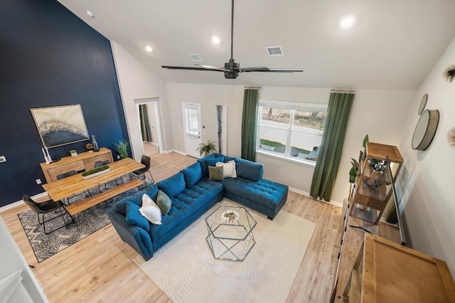 living room featuring recessed lighting, wood finished floors, visible vents, and baseboards