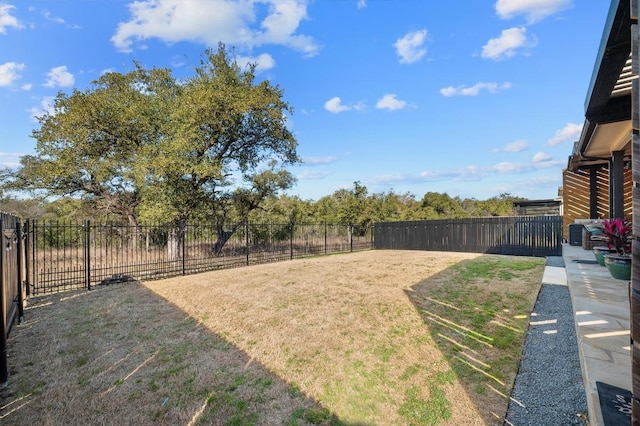 view of yard with a fenced backyard