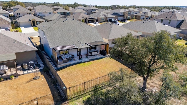 birds eye view of property with a residential view