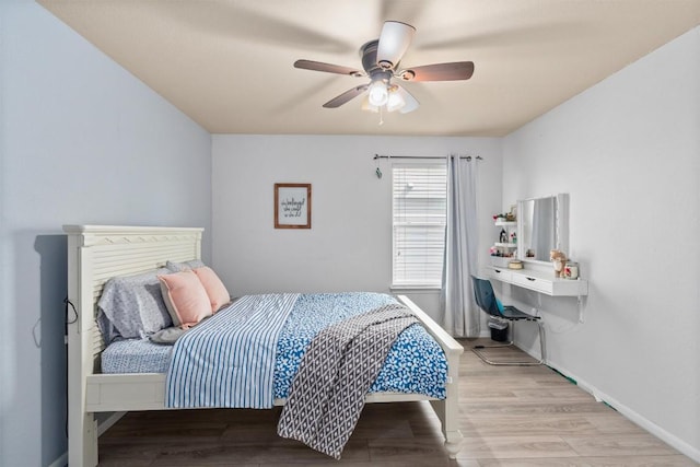 bedroom featuring a ceiling fan and light wood finished floors