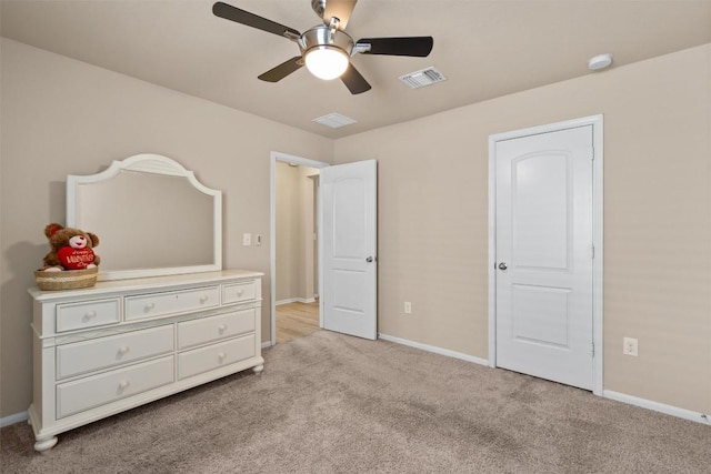 bedroom with a ceiling fan, baseboards, visible vents, and light carpet