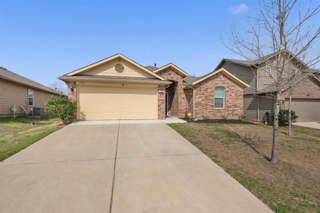 view of front facade with driveway, a front lawn, an attached garage, brick siding, and central AC unit