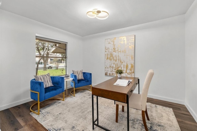 office space with baseboards and wood finished floors