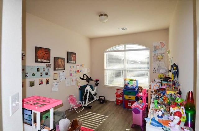 recreation room with wood finished floors and visible vents