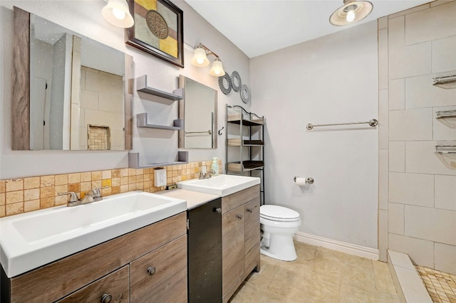 full bathroom featuring decorative backsplash, toilet, two vanities, and a sink