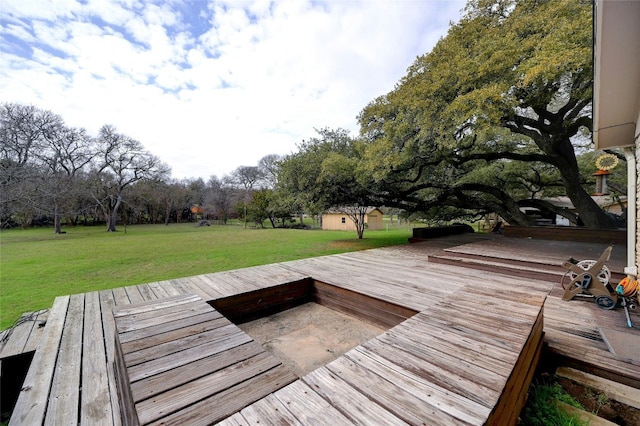 view of dock featuring a deck and a yard