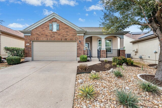 216 Farm Hill Dr, Georgetown, TX 78633 - ranch-style home with a porch, brick siding, driveway, central air condition unit, and an attached garage