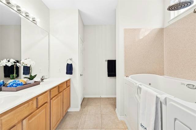 bathroom with tile patterned floors, a jetted tub, double vanity, and a sink