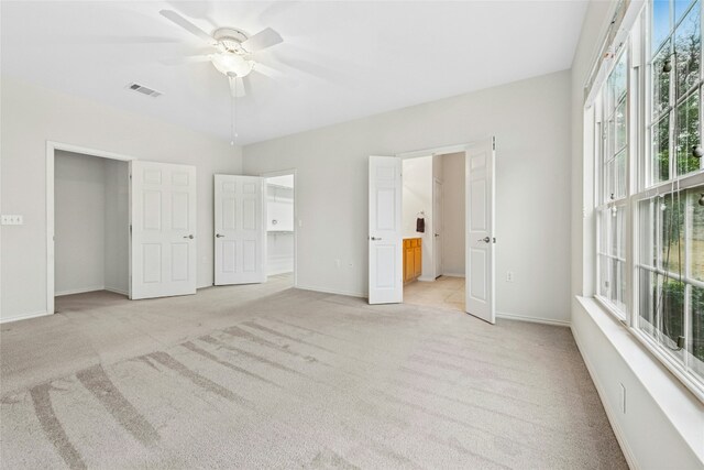 216 Farm Hill Dr, Georgetown, TX 78633 - unfurnished bedroom with light carpet, multiple windows, and baseboards