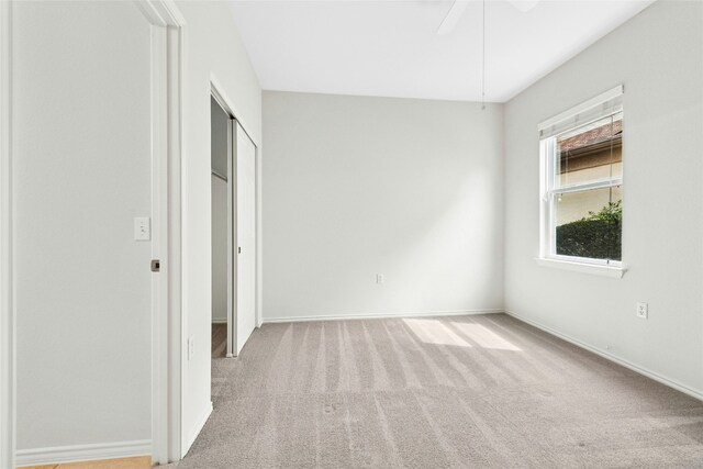 216 Farm Hill Dr, Georgetown, TX 78633 - unfurnished bedroom with carpet, baseboards, a closet, and a ceiling fan