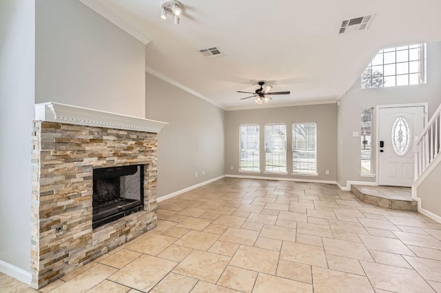 unfurnished living room with visible vents, baseboards, a fireplace, and crown molding