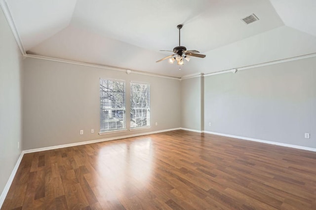 empty room with visible vents, wood finished floors, baseboards, lofted ceiling, and ceiling fan