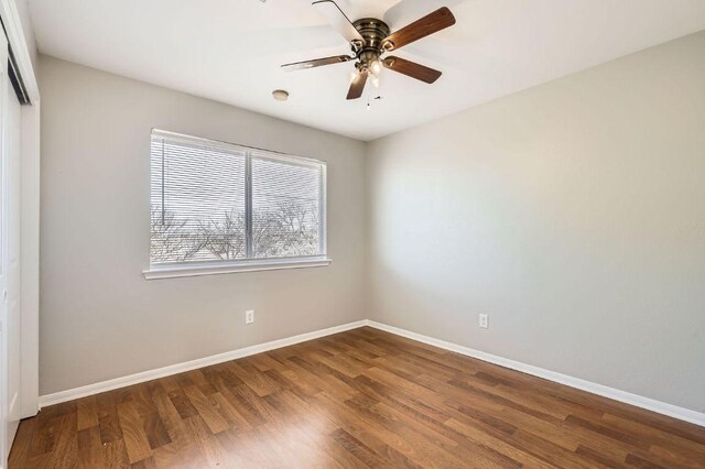 1703 Pecos Valley Cv, Round Rock, TX 78665 - spare room featuring wood finished floors, baseboards, and ceiling fan